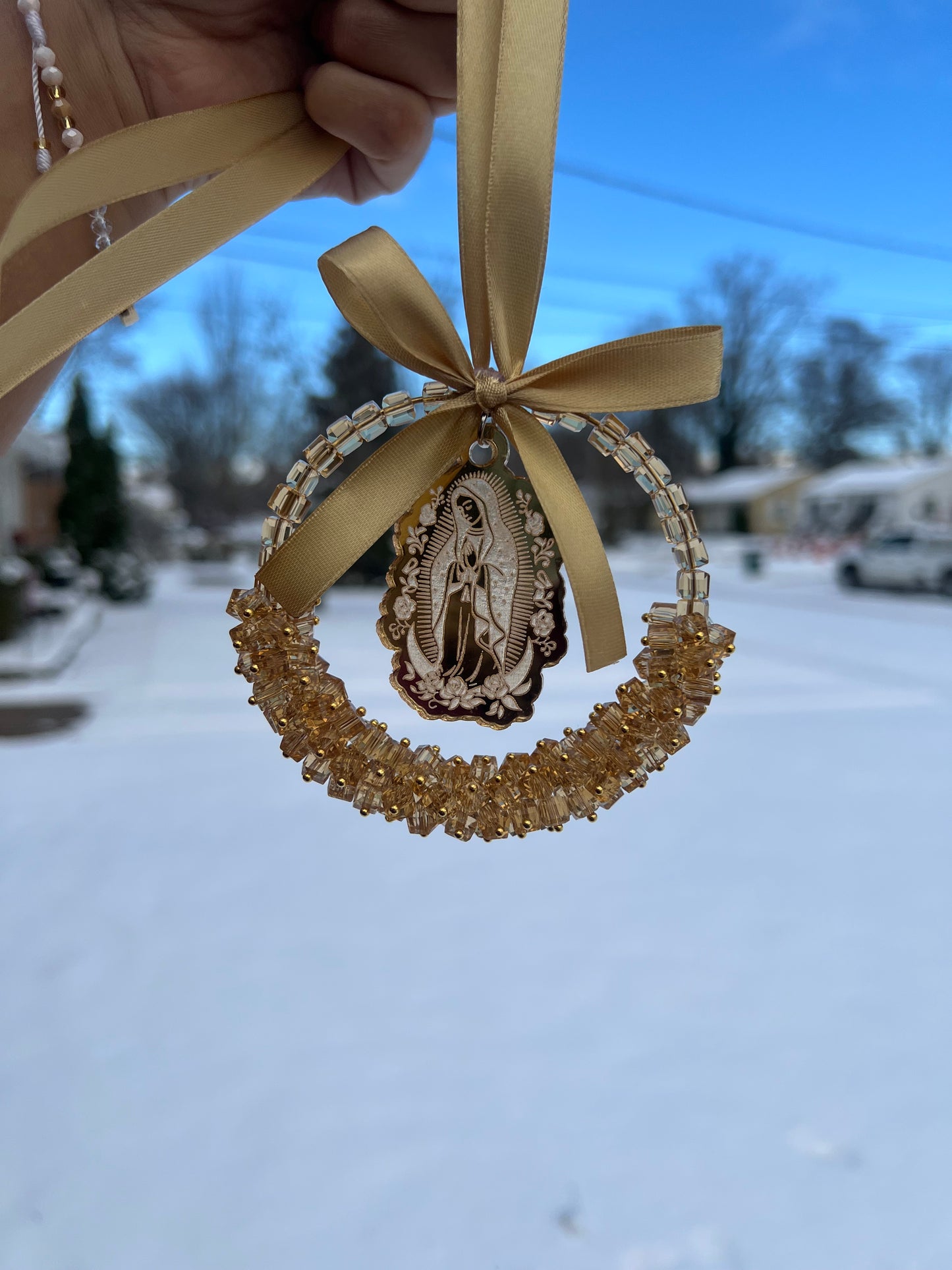 Gold car charm with gold virgencita